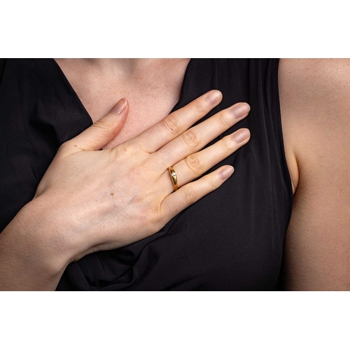 9 - A diamond-set gypsy ring, featuring a flush-set old-cut diamond of estimated 0.20ct, to a tapering y... 