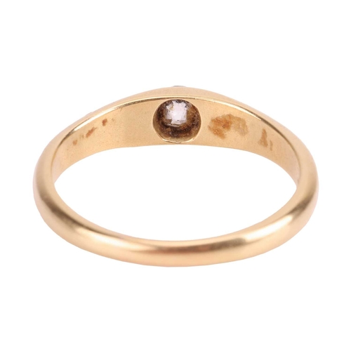 9 - A diamond-set gypsy ring, featuring a flush-set old-cut diamond of estimated 0.20ct, to a tapering y... 