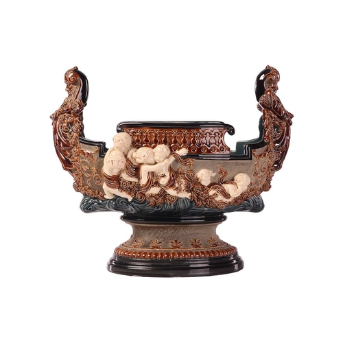 175 - A large Gerbing & Stephan majolica jardinière, late 19th century, modelled as a Viking longship on ... 
