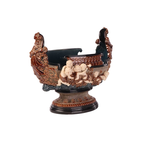 175 - A large Gerbing & Stephan majolica jardinière, late 19th century, modelled as a Viking longship on ... 
