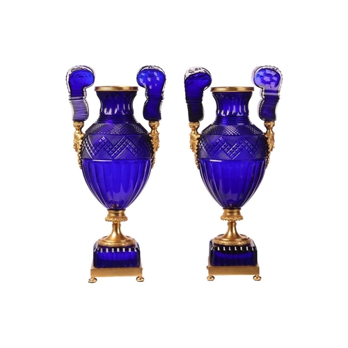 183 - A pair of large cobalt blue faceted and cut glass twin-handled vases, of Neo-classical design with o... 