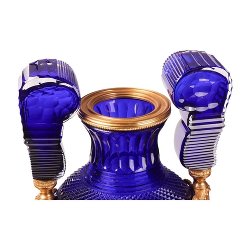 183 - A pair of large cobalt blue faceted and cut glass twin-handled vases, of Neo-classical design with o... 