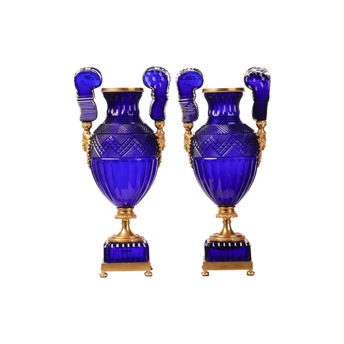 183 - A pair of large cobalt blue faceted and cut glass twin-handled vases, of Neo-classical design with o... 