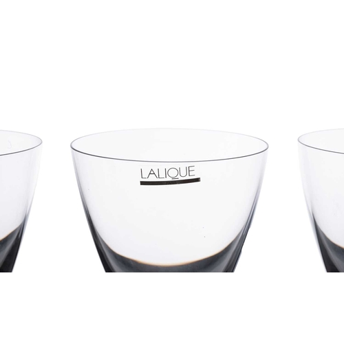 185 - Lalique: a collection of assorted contemporary crystal items, comprising: a set of four 'Louvre' win... 