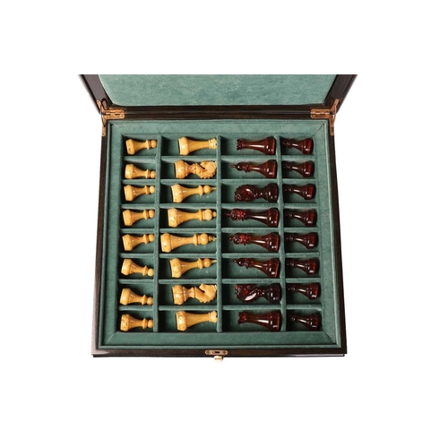 187 - A simulated amber chess set, late 20th century, the figures contained in a hardwood case with presse... 