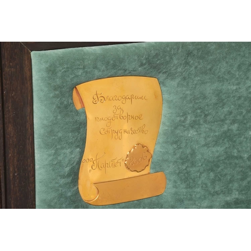 187 - A simulated amber chess set, late 20th century, the figures contained in a hardwood case with presse... 