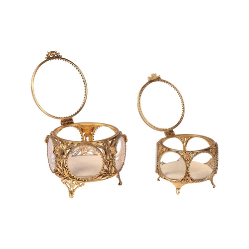 190 - A pair of Gothic-style brass two-branch candlesticks, modelled as gryphons, 21 cm high x 21 cm, toge... 