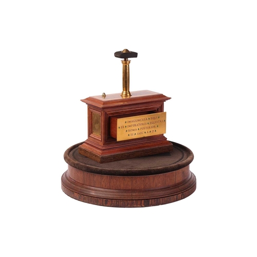 200 - A 19th-century display stand and dome, with internal display plinth, bearing a plaque with Latin tex... 