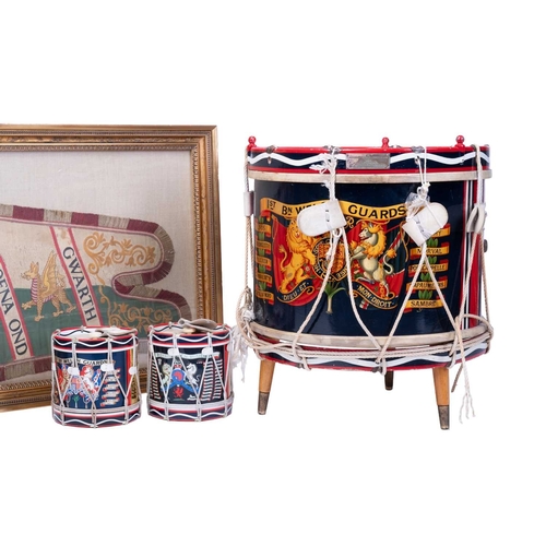 208 - A 19th-century needlework military flag, Welsh Guards, of shaped outline, with a Lion Gardant and tw... 