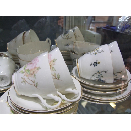 12 - 4 China tea sets (1 set missing one cup)