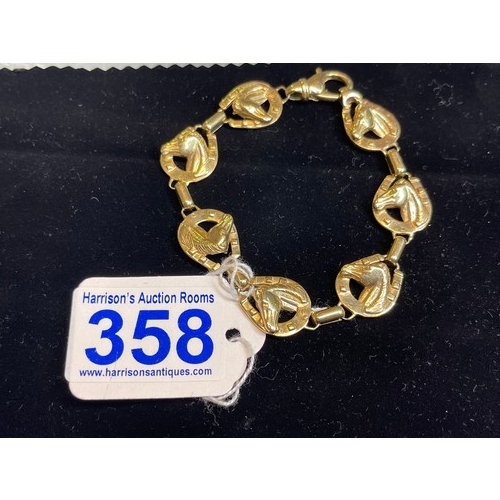 358 - 9ct gold horse shoe/head bracelet 35g