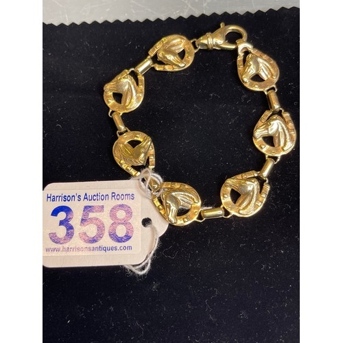 358 - 9ct gold horse shoe/head bracelet 35g