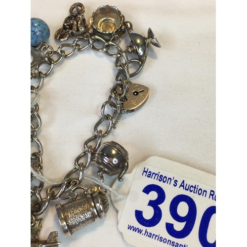 390 - Silver charm bracelet 52.2g total