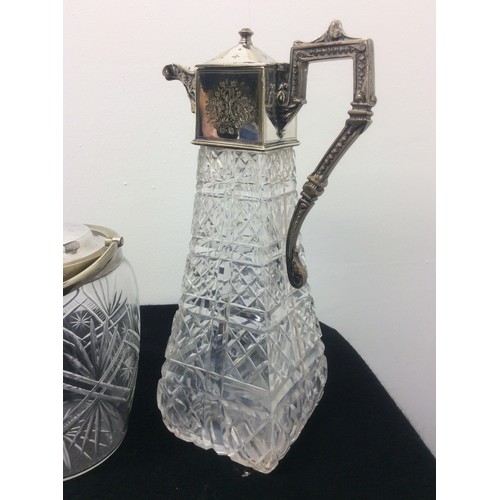 10 - Cut glass claret jug, biscuit barrel & decanter all with silver plate tops