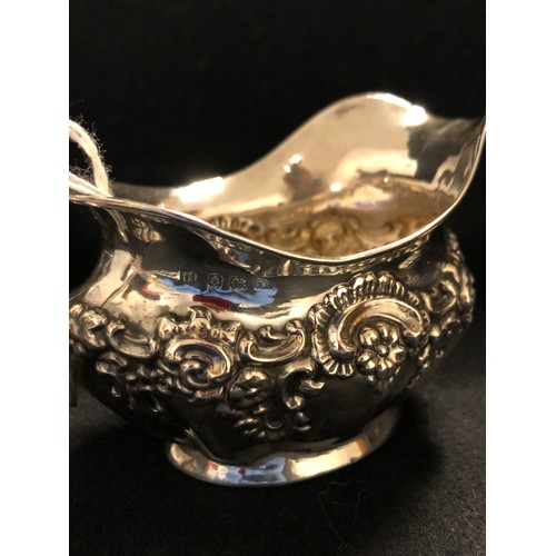 38 - 3 Pieces silver, vase , cream jug sugar bowl all hall marked 334g