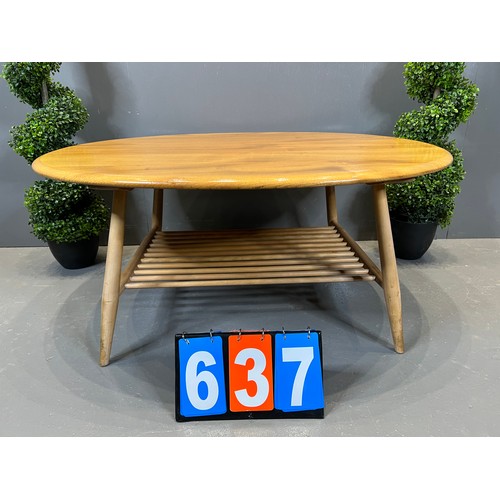 637 - Ercol blonde pebble coffee table with magazine rack base