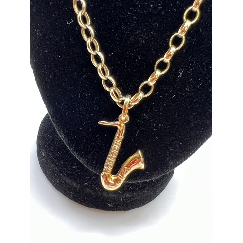 286 - 9ct Gold chain & 9ct Gold saxophone pendant 11g