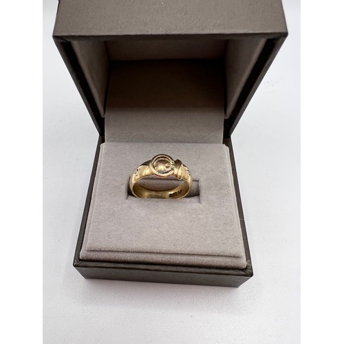 296 - 9ct Gold buckle ring set with 2 diamonds size Q 5.1g total