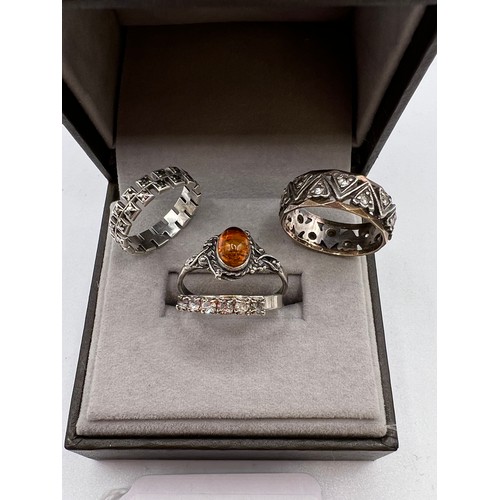 303 - 1x9ct gold & silver ring + 3 other rings