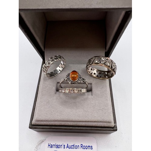 303 - 1x9ct gold & silver ring + 3 other rings