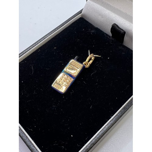 327 - 9ct Gold & enamel mobile phone pendant 1g