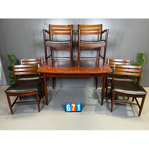 671 - Danish? mid century teak table + 6 chairs (superb design rare and seat covers worn)