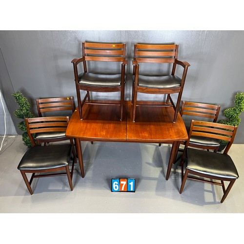 671 - Danish? mid century teak table + 6 chairs (superb design rare and seat covers worn)