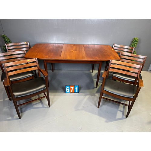 671 - Danish? mid century teak table + 6 chairs (superb design rare and seat covers worn)