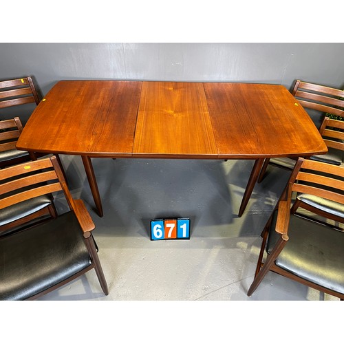 671 - Danish? mid century teak table + 6 chairs (superb design rare and seat covers worn)