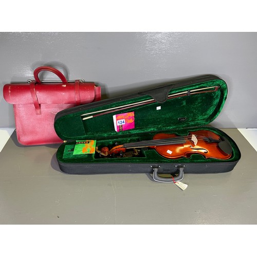 124 - Violin in case + a bag of music