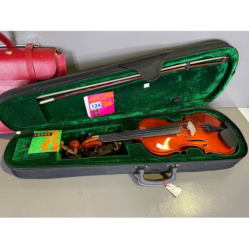 124 - Violin in case + a bag of music