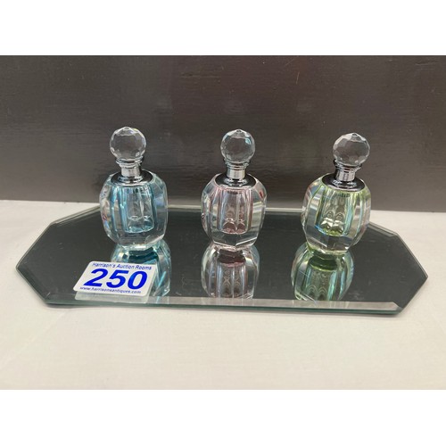 250 - Glass perfume bottles on glass stand