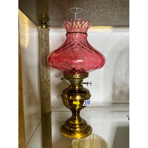 370 - Brass & cranberry glass oil lamp with funnel