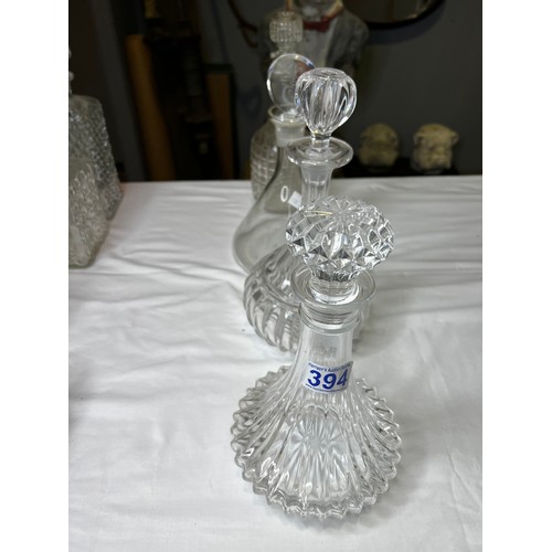 394 - 4 Glass decanters