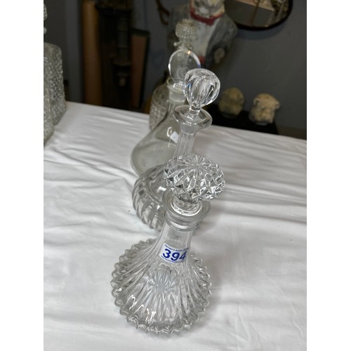 394 - 4 Glass decanters