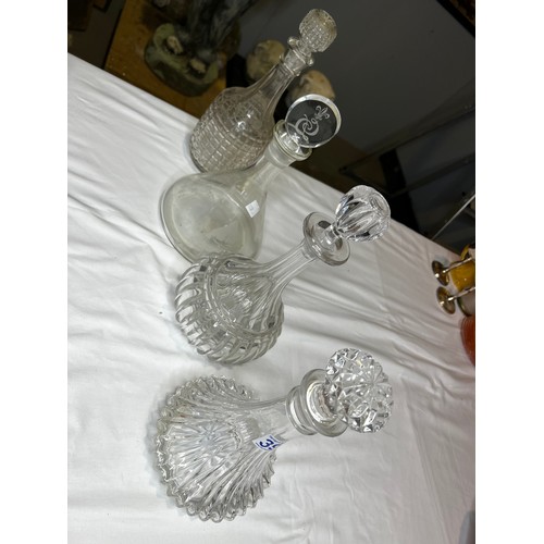 394 - 4 Glass decanters