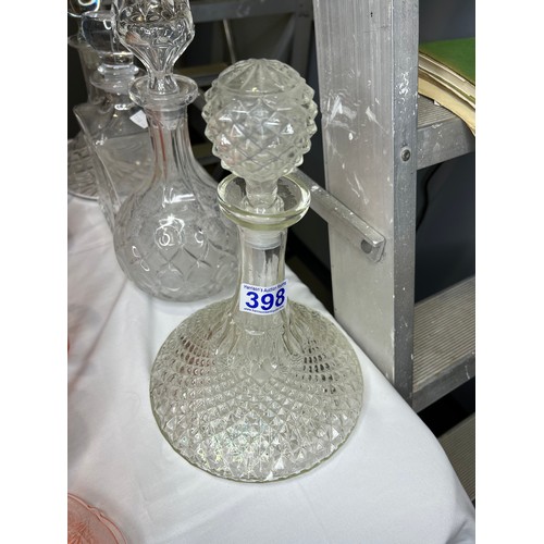 398 - 4 Glass decanters