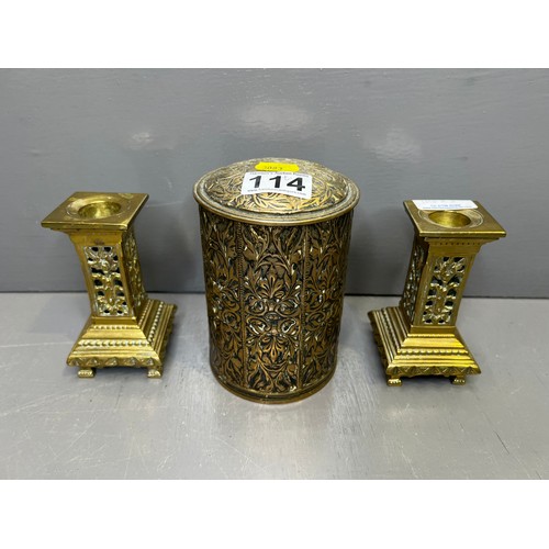 114 - Pair of early brass candle sticks + brass scribed lidded jar