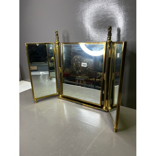 194 - Brass frame triple mirror with lion tops