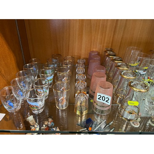 202 - 9 Sets of glasses inc collectable cars