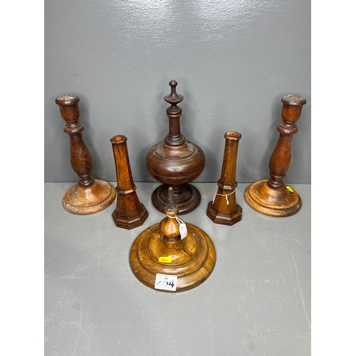 254 - Collection of treen ware to include candle sticks