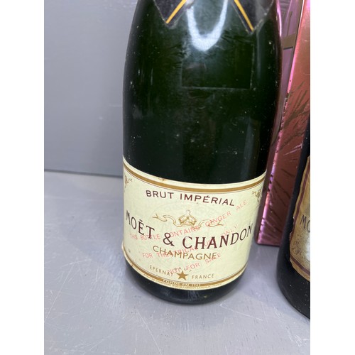 308 - 1Bottle of Moet & Chandan champagne +1Bottle of Moet & Chandan stamped contauins ginger beer for the... 