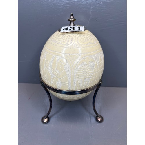 431 - 20th century silver plated stand with carved ostrich egg