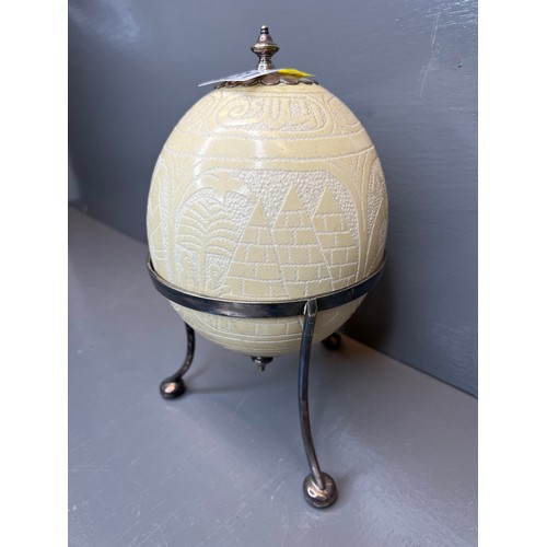431 - 20th century silver plated stand with carved ostrich egg