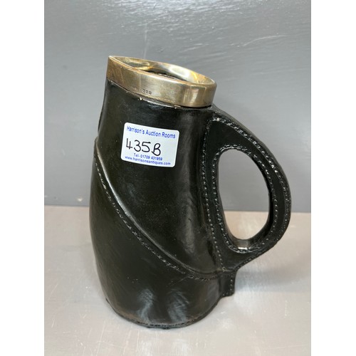 435B - Early royal Doulton leather jack jug with silver rim