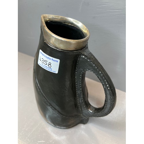 435B - Early royal Doulton leather jack jug with silver rim
