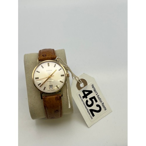 452 - Garrard 9ct gold gents watch with leather strap automatic inscribed