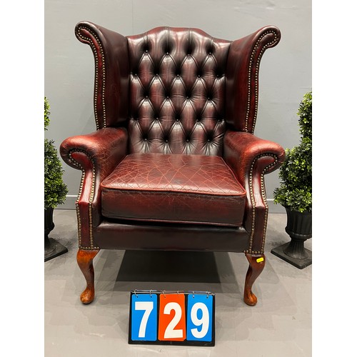 729 - Leather chesterfield wing back chair (better quality leather)