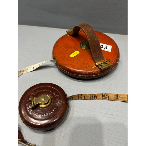 43 - 2 Vintage leather rabone tape measures