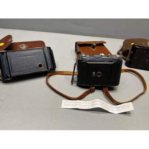 44 - 3 Vintage cameras in cases